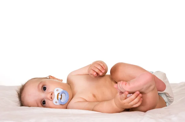 Słodkie dziecko ze smoczków do karmienia niemowląt — Zdjęcie stockowe