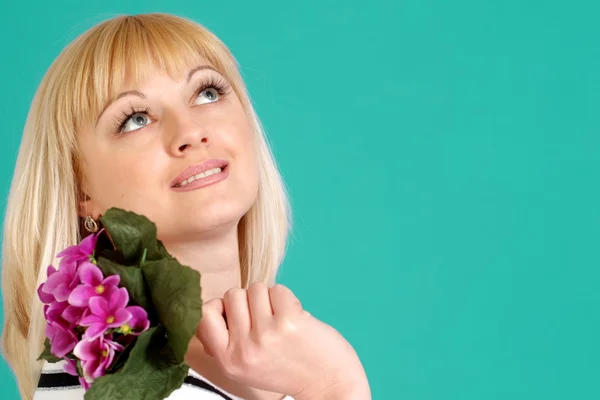 Portrait of a beautiful blonde Caucasian female with flowers — Stock Photo, Image