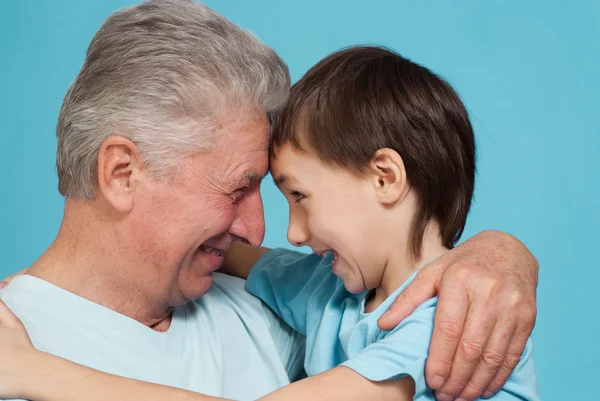 Happy nice Caucasian grandfather with his grandson fooled — Stock Photo, Image