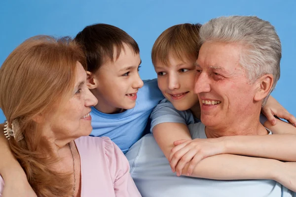 Happy Caucasian grandparents with grandchildren fooled — Stock Photo, Image