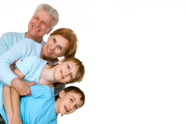 Happy love grandparents with grandchildren fooled — Stock Photo, Image