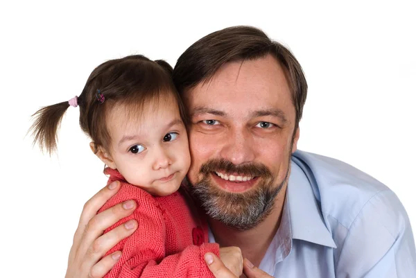 Beautiful Caucasian caring papa holding his daughter in his arms — Stock Photo, Image