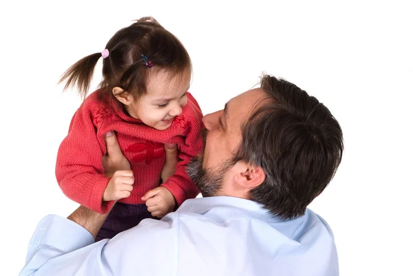 stock image Caucasian caring father holding his daughter in his arms