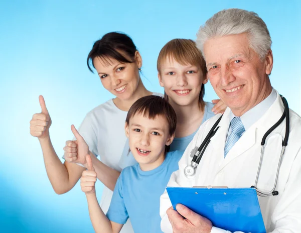 Beautiful Caucasian elderly doctor with a patient — Stock Photo, Image