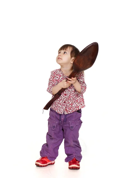 Het kleine meisje verwent in een mooie Kaukasische met lepel — Stockfoto