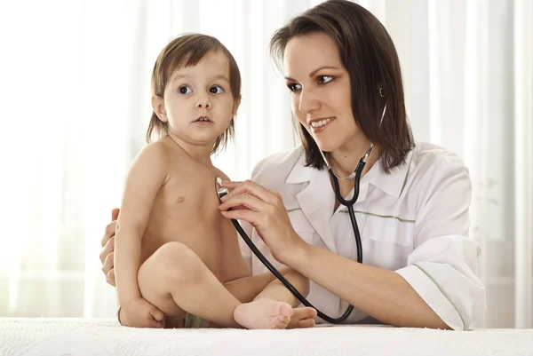 The child to the doctor Stock Picture