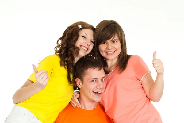 Bright Caucasian boy holding two girls in her arms Stock Photo