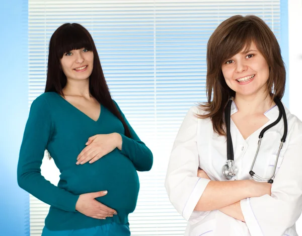 Beautiful Caucasian pregnant woman to the doctor Stock Photo