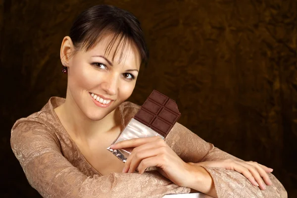 Beautiful Caucasian woman with chocolate — Stock Photo, Image