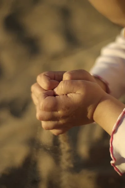 stock image Concept hands sypyat sand