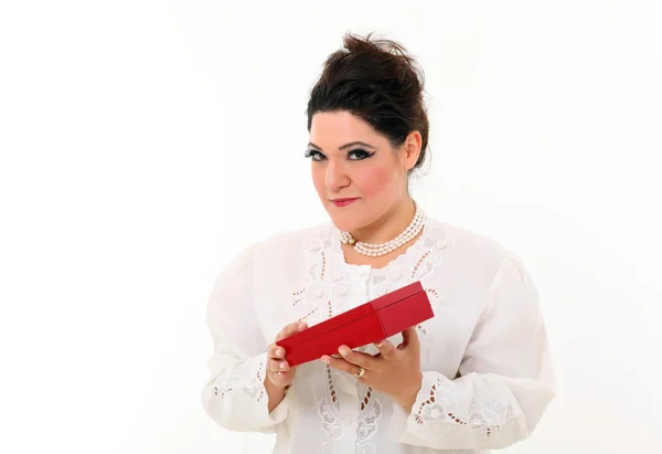 Beautiful plus size woman with a gift — Stock Photo, Image