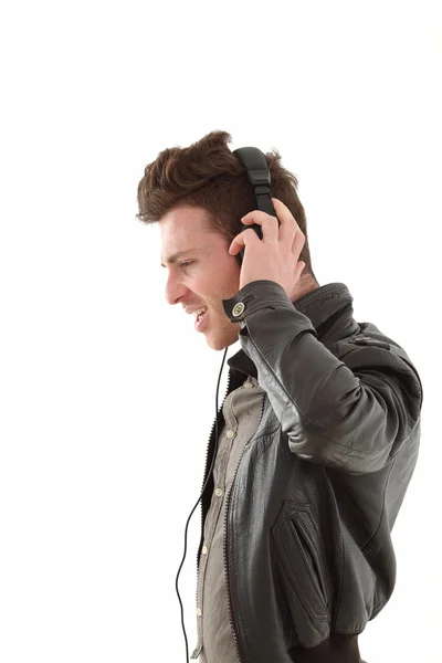 Profil de young adult male listening music — Photo