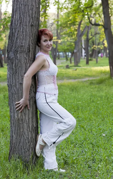 Harmonous woman near a tree in the summer — Stock Photo, Image