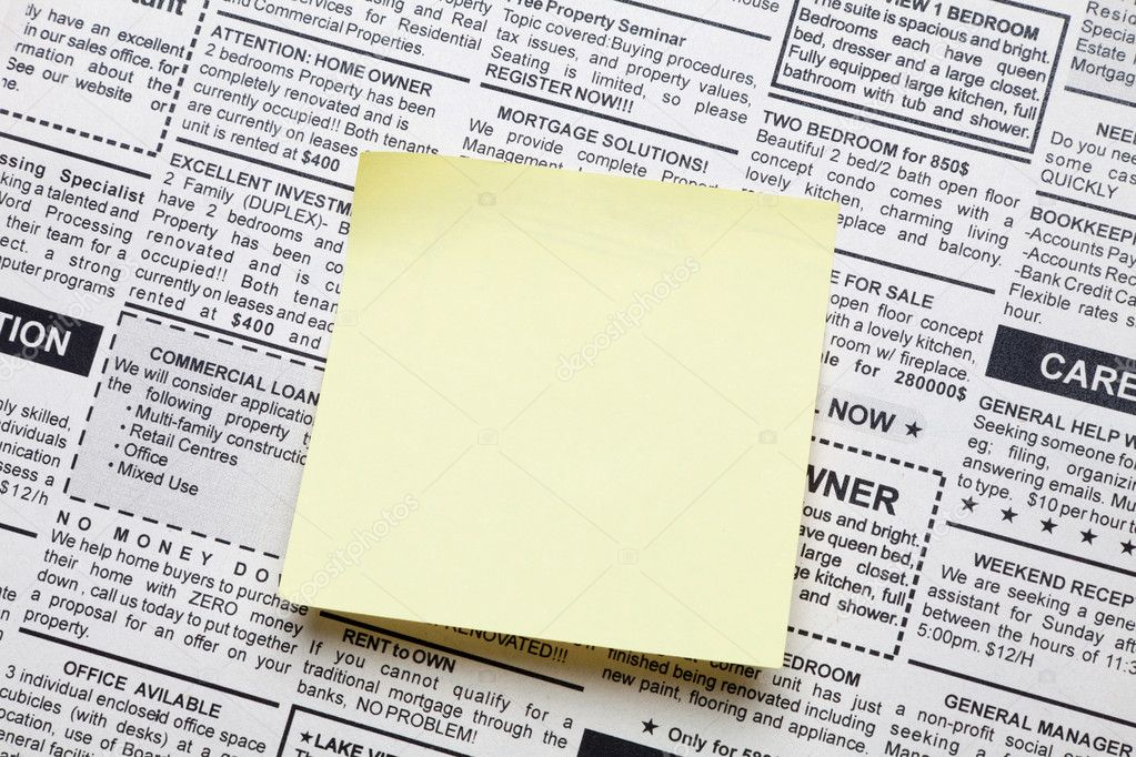 Newspaper and sticky note