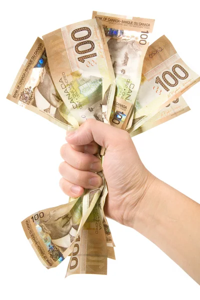 Une main pleine de dollars canadiens — Photo