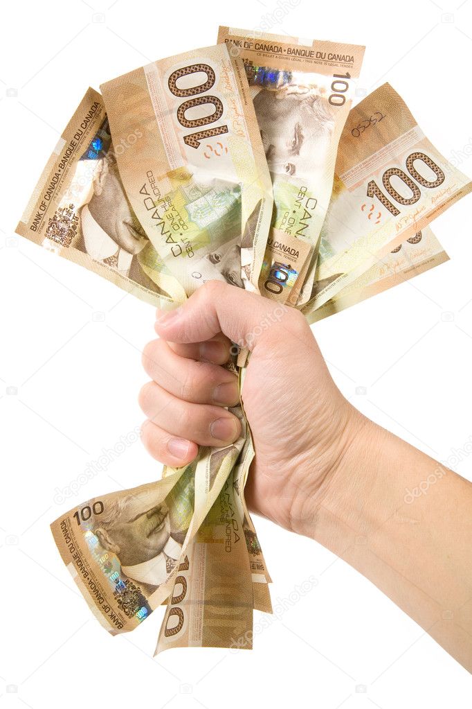 A hand full of canadian dollars