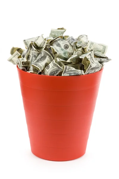 Dólares em lata de lixo vermelho — Fotografia de Stock