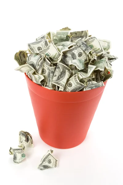 Dólares em lata de lixo vermelho — Fotografia de Stock