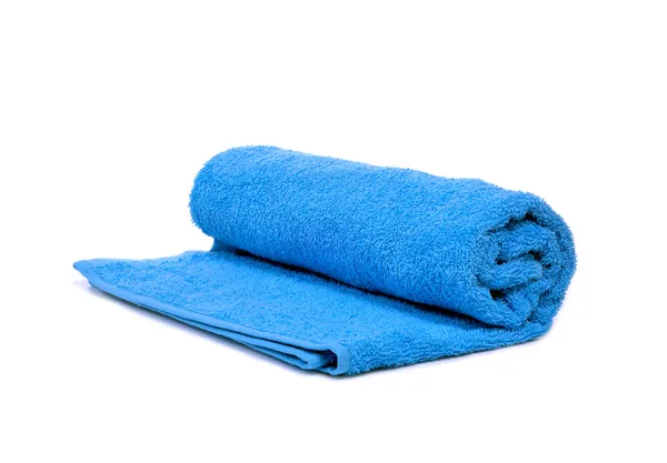 Un asciugamano blu arrotolato — Foto Stock