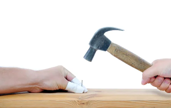 Carpenter with hammer and injured fingers — Stock Photo, Image