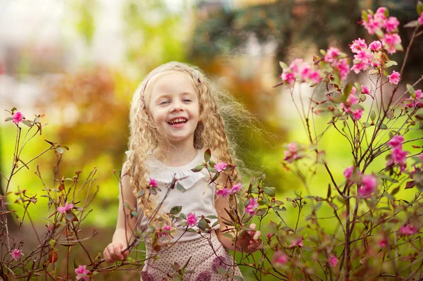 Beautiful girl and pink flowers — Stock Photo, Image