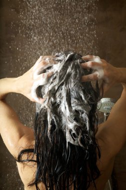 Woman washing her hair clipart