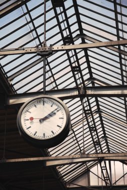 Old clock at a train station clipart