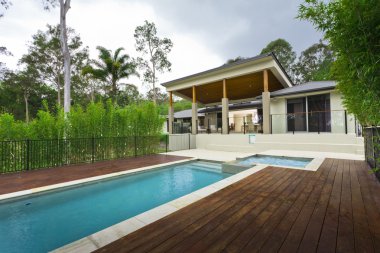 Modern backyard with pool clipart