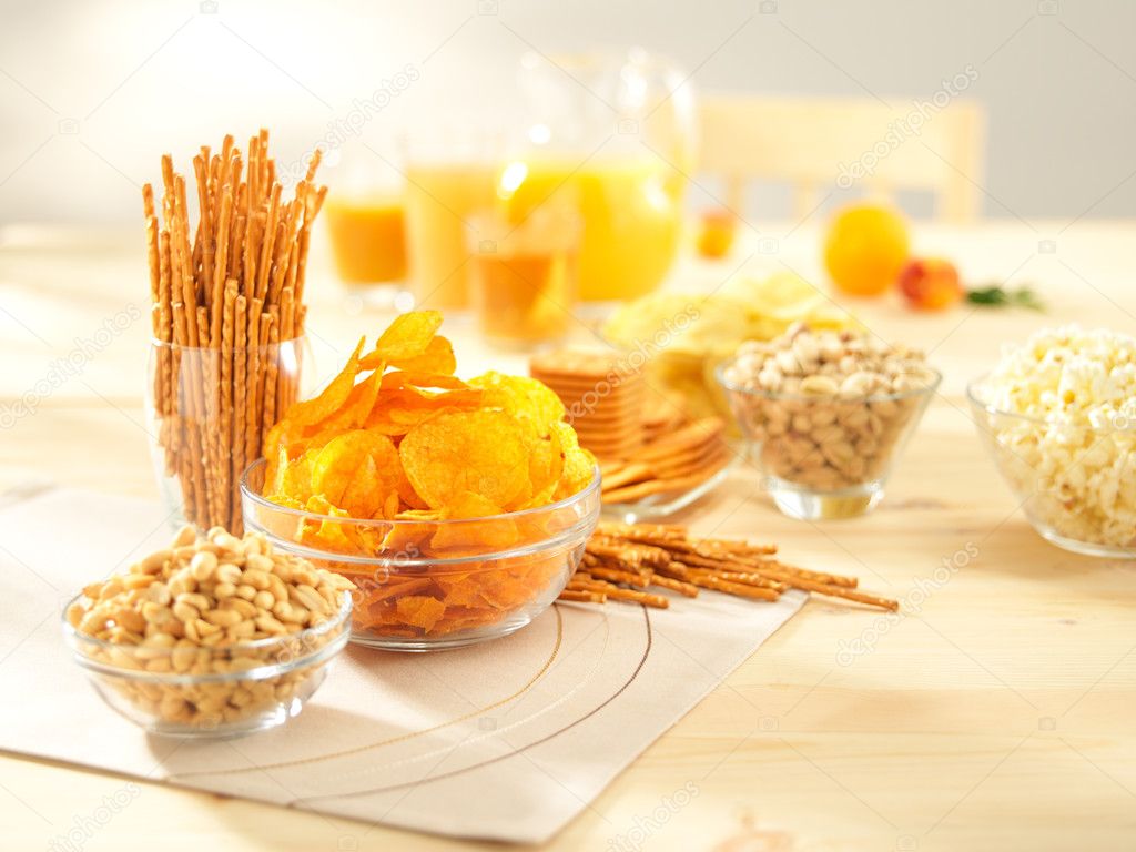 Salty snacks. Pretzels, chips, peanuts, crackers, popcorn — Stock Photo