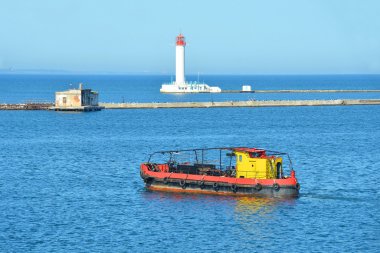 Industrial pilot ship and lighthouse clipart