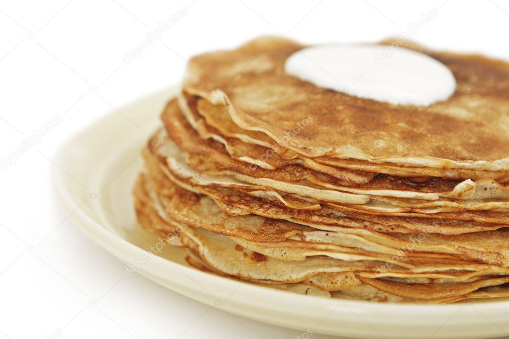 Pile of pancakes on plate isolated