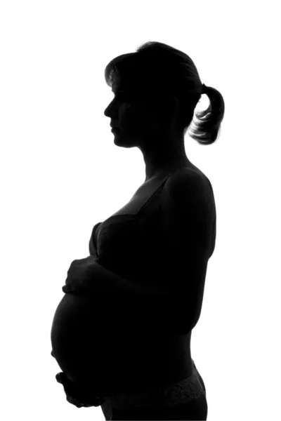 白い背景に妊娠中の女性のシルエット — ストック写真