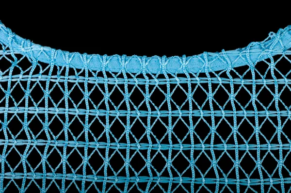 stock image Blue knitting fabric isolated on black