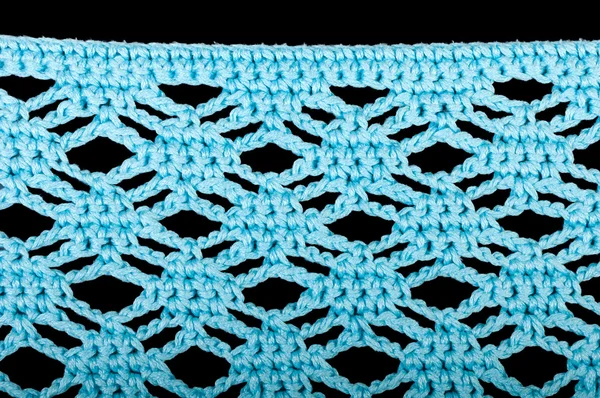 Blue knitting fabric isolated on black — Stock Photo, Image
