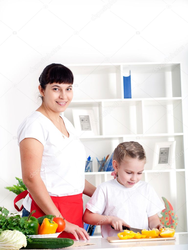 Mom and daughter cooking together