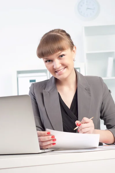 Woman works in the office Stock Photo