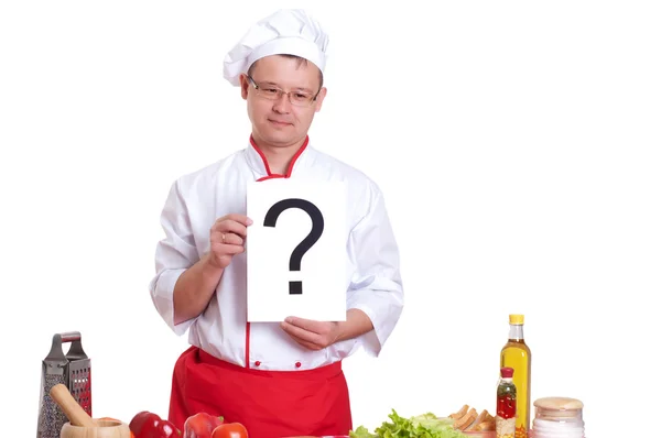 Chef sosteniendo un letrero con un signo de interrogación de inscripción — Foto de Stock