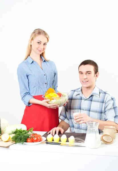 Wife gives her husband a meal Stock Photo