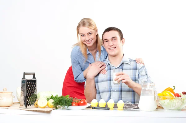 Wife gives her husband a meal Stock Image