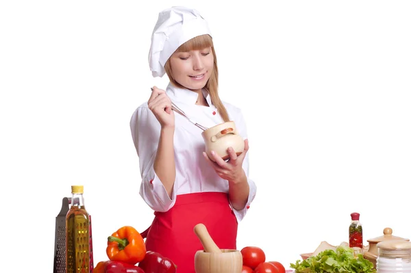 Atractiva mujer cocinera un fondo sobre blanco —  Fotos de Stock
