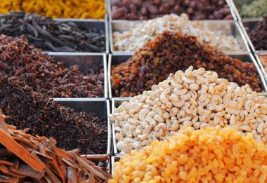 Dry fruits & spices displayed for sale in a bazaar clipart