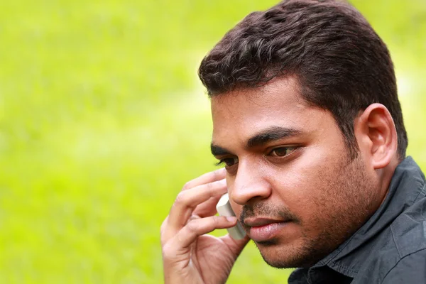 stock image Photo of handsome young indian/south asian businessman talking a