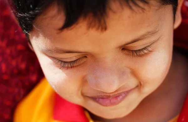 Extreme closeup photo of handsome young but shy indian/asian boy — Stock Photo, Image