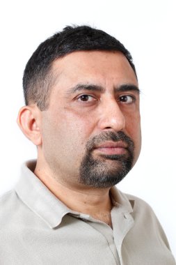 Close-up photo of face of an handsome indian man having cautious clipart