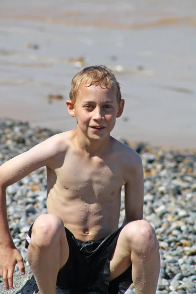 Teenage boy in the sea — Stock Photo, Image