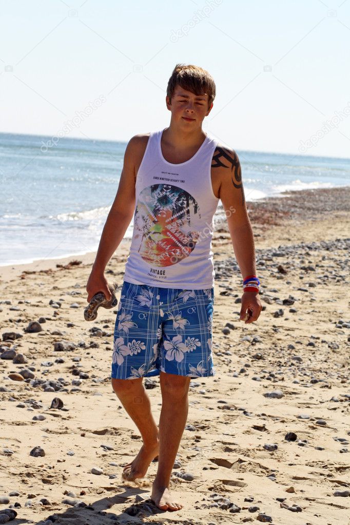 Teenage boy by the sea