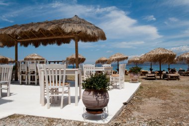 Greek taverna on the beach clipart