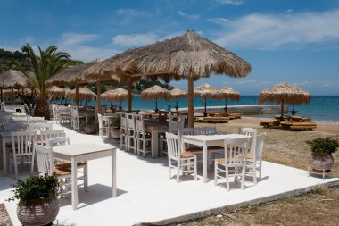 Restaurant on the beach in Greece clipart