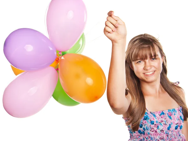 Дівчина-підліток грає з повітряними кулями — стокове фото
