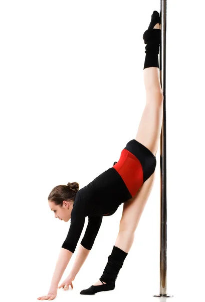 Jovem mulher sexy exercício pole dance — Fotografia de Stock